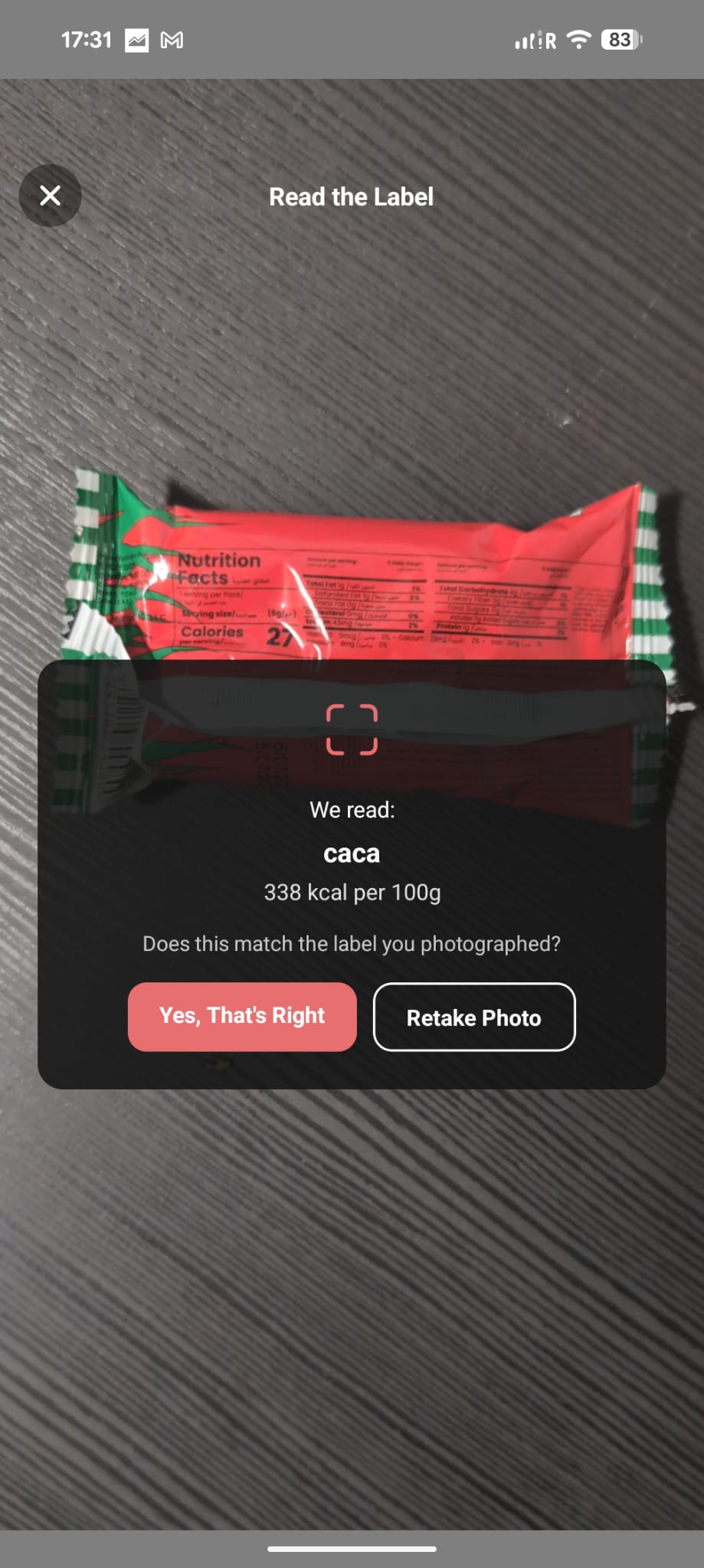nYOOtrition Read the Label screen — nutrition label photographed, showing 'We read: Caca, 338 kcal per 100g' with Yes That's Right and Retake Photo buttons