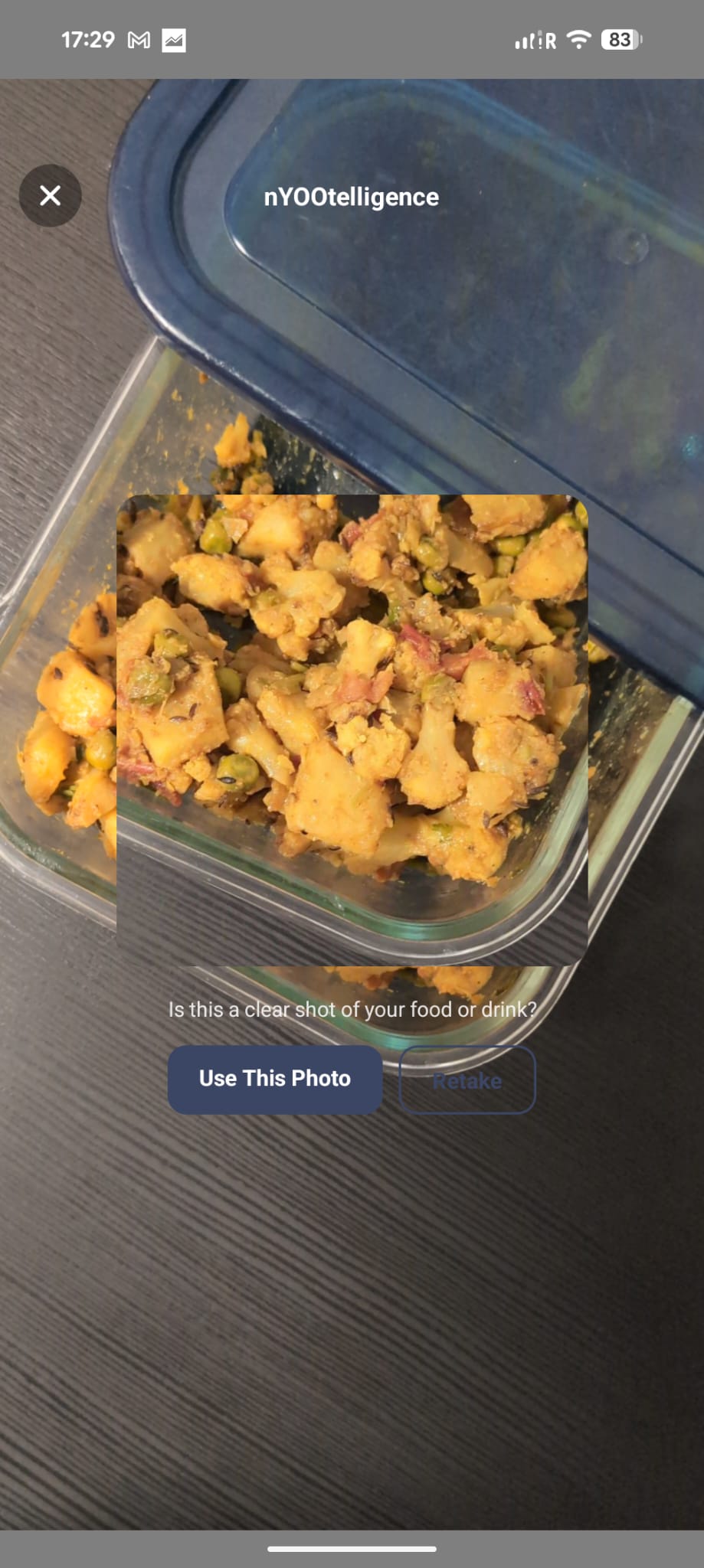 nYOOtelligence photo capture screen — a home-cooked dish, asking 'Is this a clear shot of your food or drink?' with Use This Photo and Retake buttons